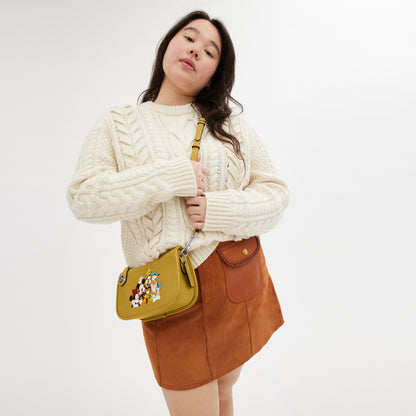 Disney X Coach Swinger Bag In Regenerative Leather With Mickey Mouse And Friends