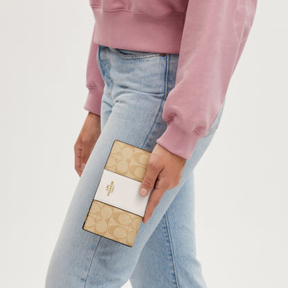 Slim Zip Wallet In Signature Canvas With Stripe