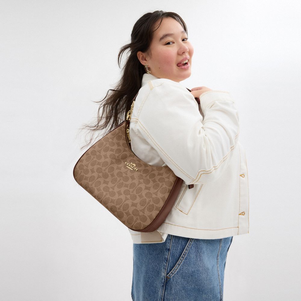 Teri Hobo Bag In Signature Canvas