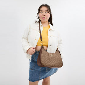 Teri Hobo Bag In Signature Canvas