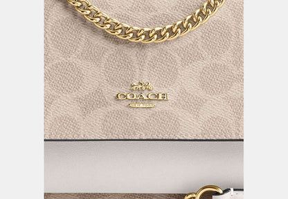Mini Klare Crossbody Bag In Signature Canvas
