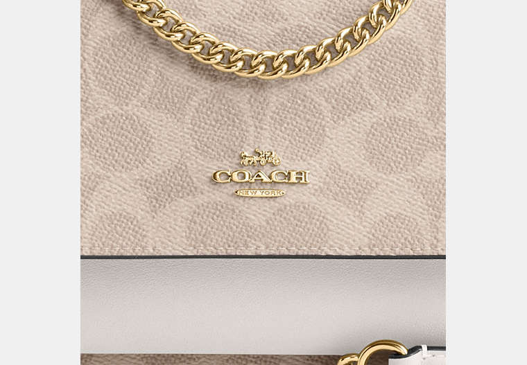 Mini Klare Crossbody Bag In Signature Canvas