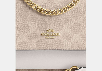 Mini Klare Crossbody Bag In Signature Canvas