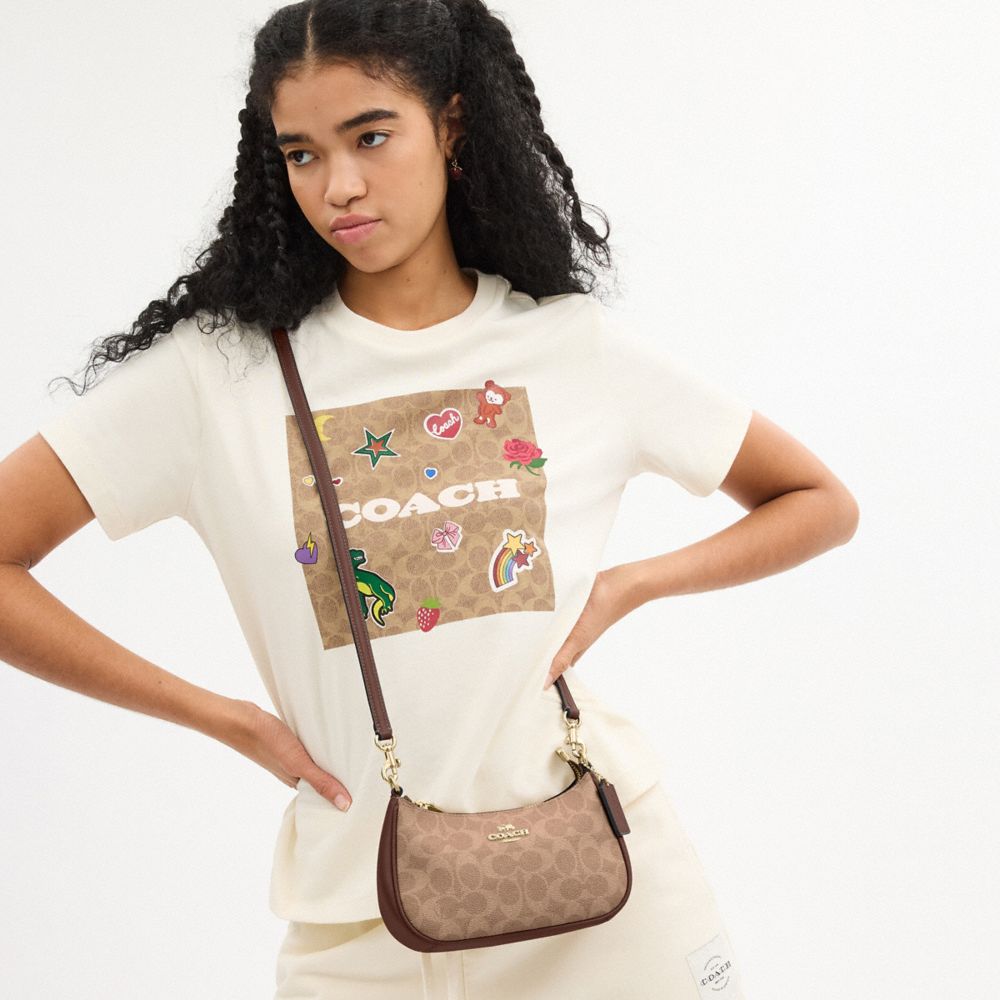 Teri Mini Crossbody Bag In Signature Canvas