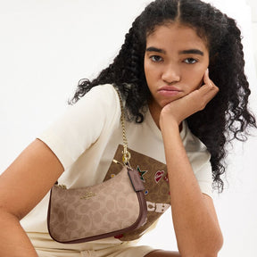 Teri Mini Crossbody Bag In Signature Canvas