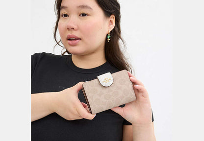 Medium Corner Zip Wallet In Signature Canvas