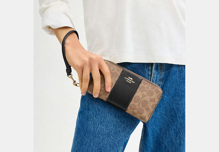Long Zip Around Wallet In Signature Canvas With Stripe