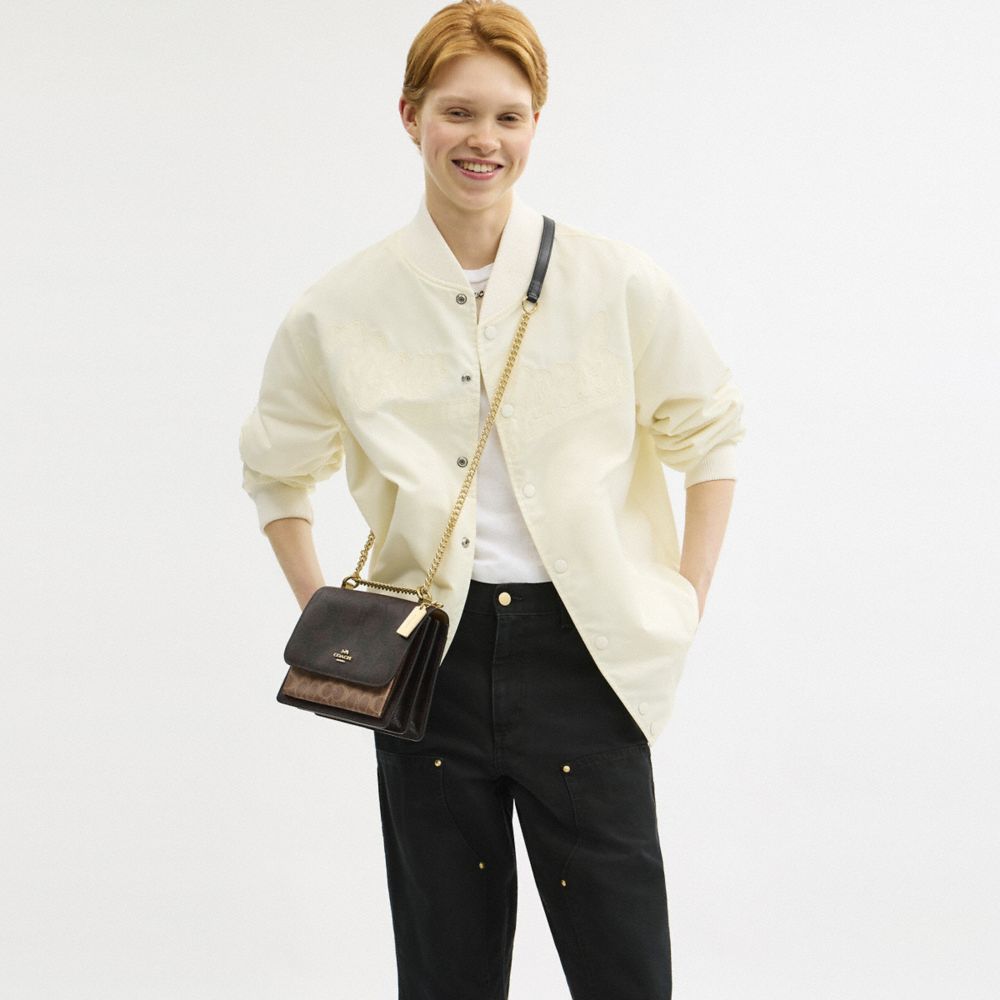 Klare Crossbody Bag In Blocked Signature Canvas