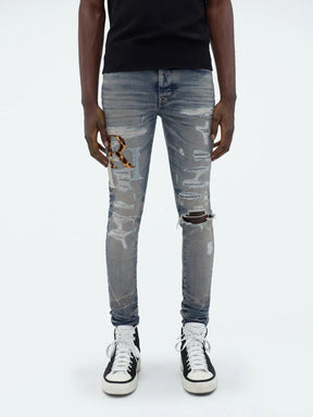 Amiri Leather Staggered Logo Jeans in Blue