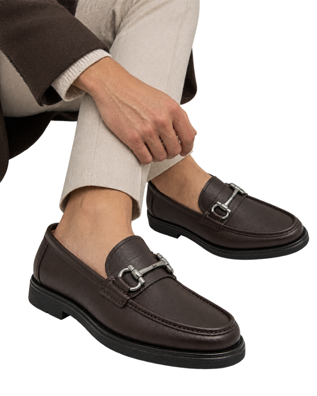 Ferragamo Gancini dark brown leather loafer featuring a signature