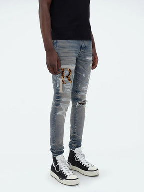 Amiri Leather Staggered Logo Jeans in Blue