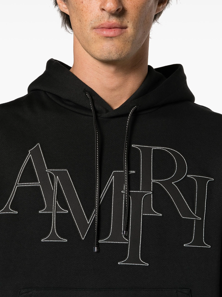 Amiri Staggered Logo Hoodie in Black