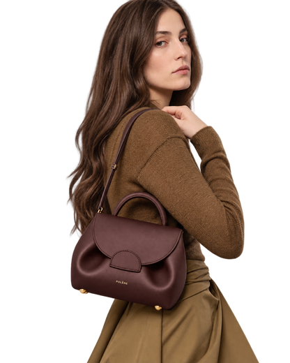 [AI-GENERATED:MODEL_PRIMARY] Numéro Un Nano Edition Textured Burgundy — Human Model
