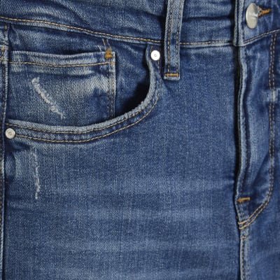 Petite blue mid rise flared jeans