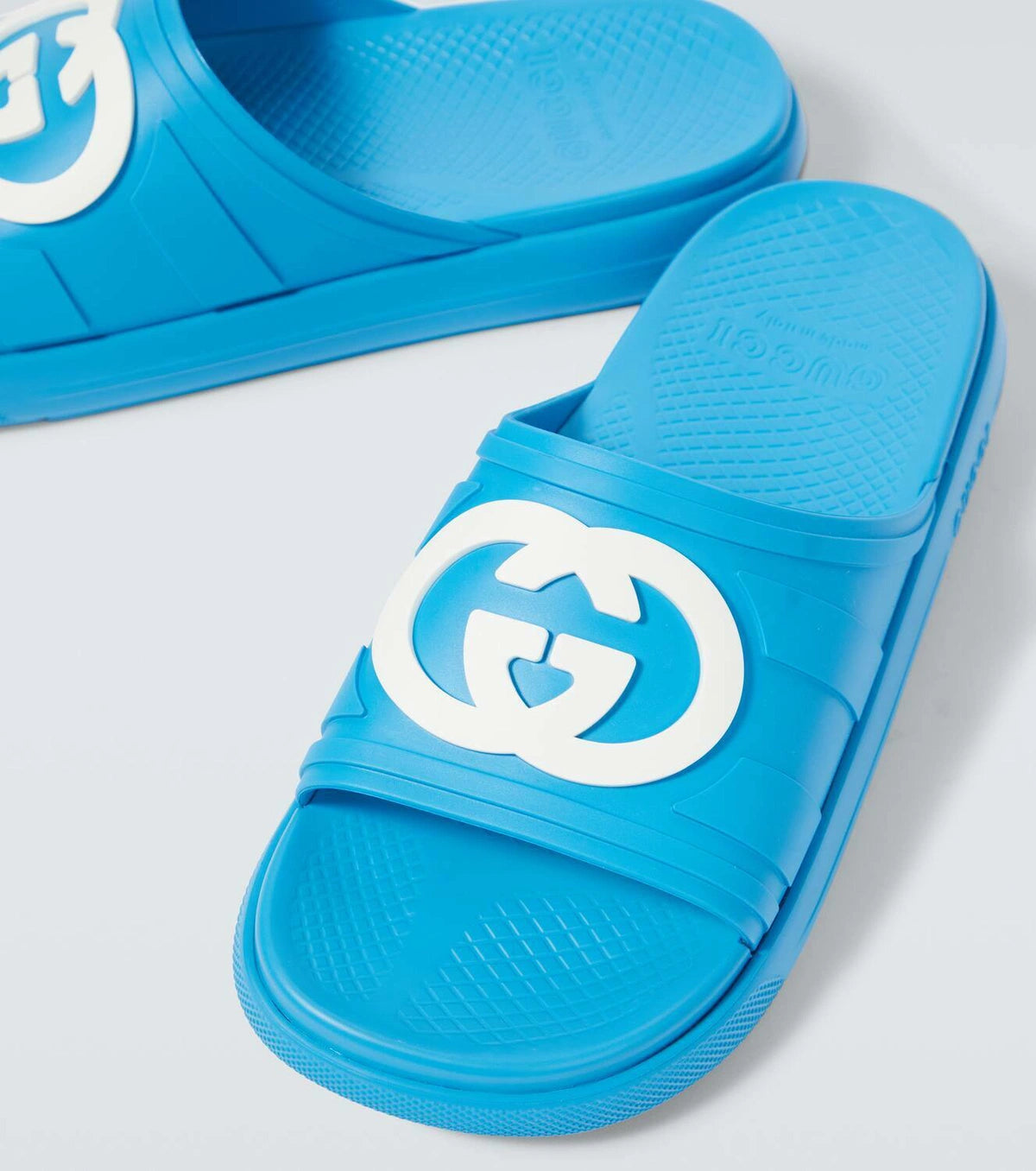 Gucci Pursuit Interlocking G slides in blue with moulded rubber upper and iconic Interlocking G logo on strap
