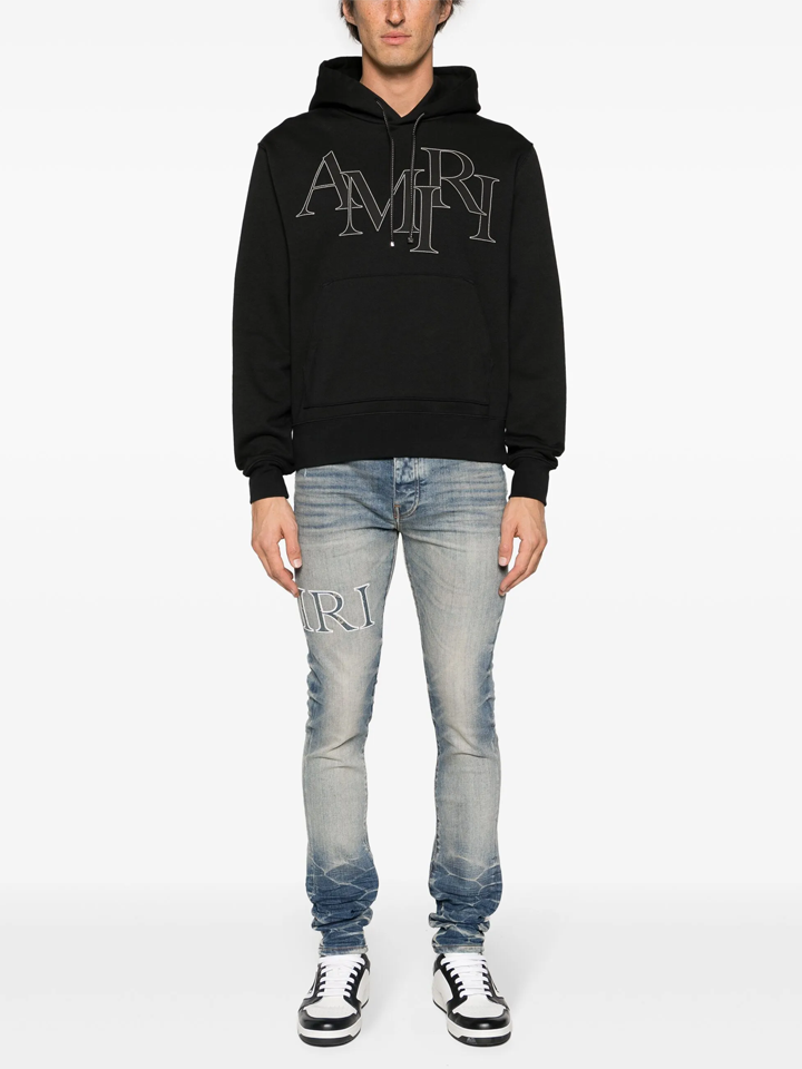 Amiri Staggered Logo Hoodie in Black
