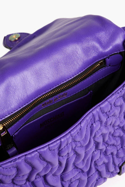 Moschino MOSCHINO Destroyed Chain buckle-embellished quilted leather cross-body bag - Bags | Shop From The Mirage